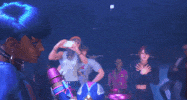 a person with blue hair is holding a microphone and waving