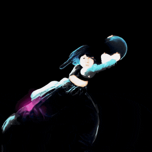 a woman in a black top and black pants is dancing on a black background