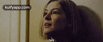 a close up of a woman 's face with the words `` i 'm it '' .