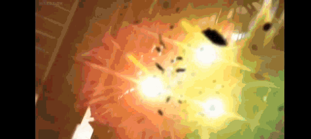 a blurry picture of an explosion with a lot of smoke coming out of it