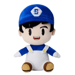 a stuffed toy of a boy wearing a blue hat with the letter s on it .