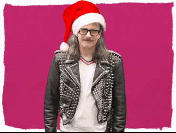 a man wearing glasses and a santa hat