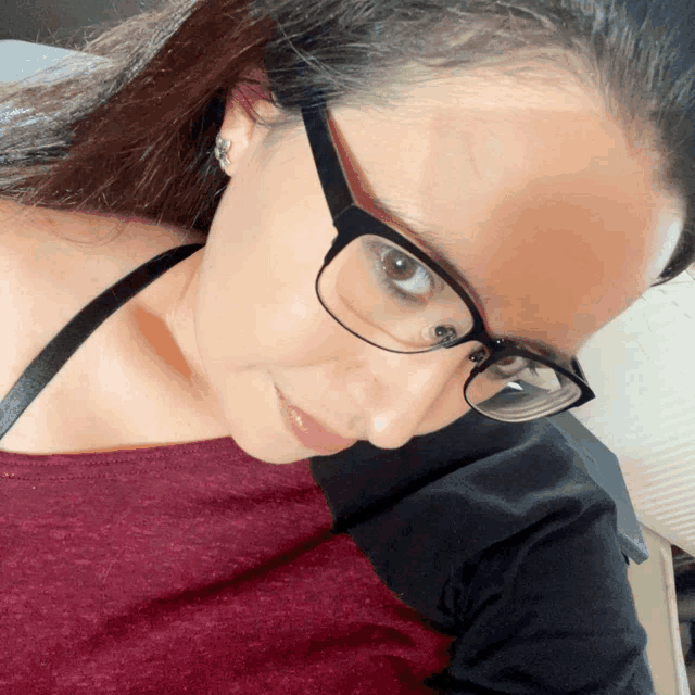 a close up of a woman wearing glasses