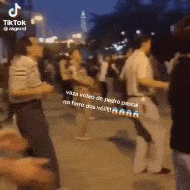 a group of people are dancing on a street in a video that says tiktok @asgarrd