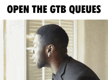 a man looking out a window with the words open the gtb queues written above him