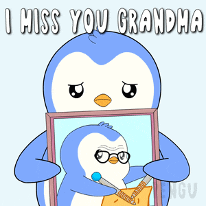 a penguin is holding a picture of another penguin with the words i miss you grandma above it