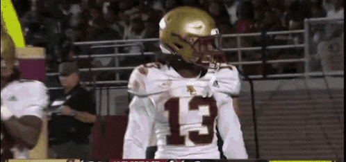 a football player wearing a jersey with the number 13