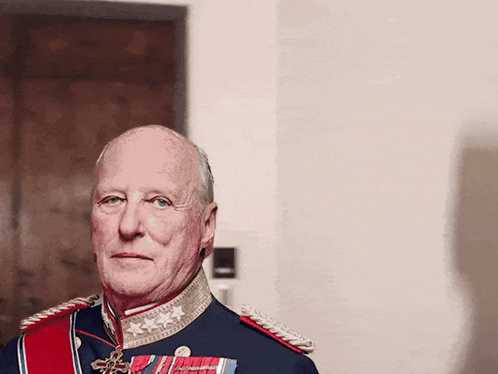 a man in a military uniform with medals on his chest
