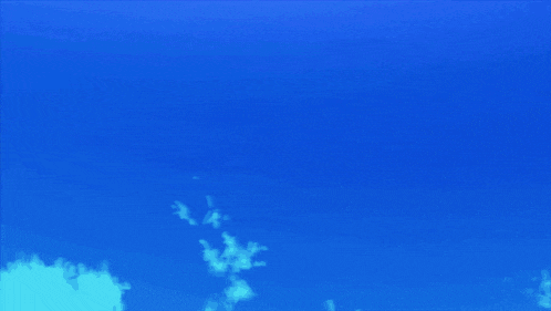 a blue sky with purple clouds and a purple glowing object