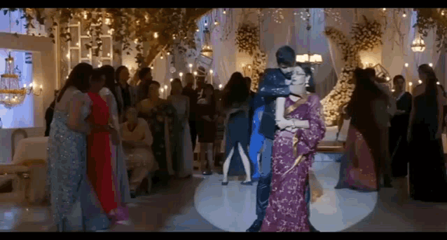 a man and a woman are dancing on a dance floor at a wedding reception .