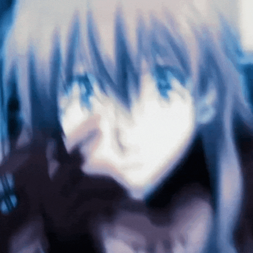 a blurry picture of a girl with blue hair and blue eyes