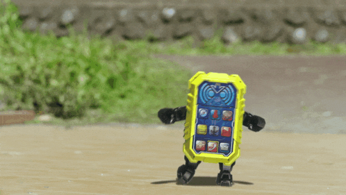 a yellow toy cell phone with a blue screen and buttons on it