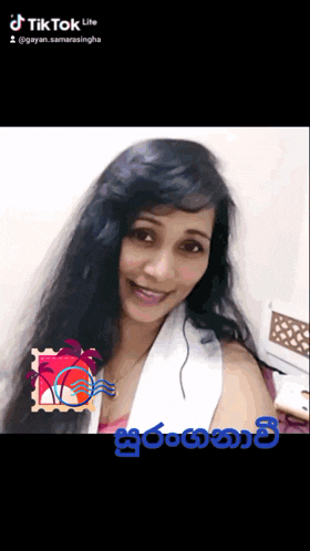a woman with long black hair is smiling in a tiktok video