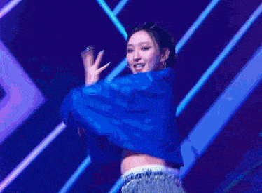 a blurry picture of a person in a blue and purple outfit