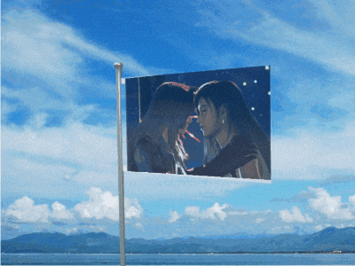 a picture of two women kissing on a flag pole
