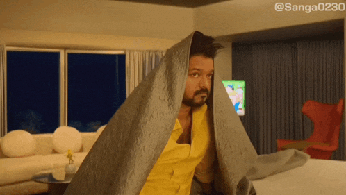a man is wrapped in a blanket with the hashtag sanga023o on the bottom