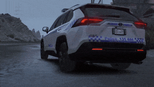a white police car with the number 131 444 on the back