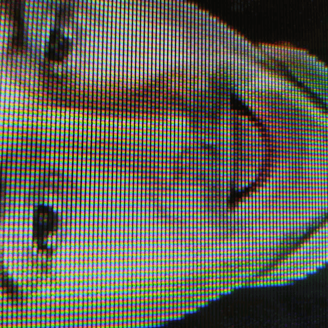 a close up of a person 's face on a computer screen