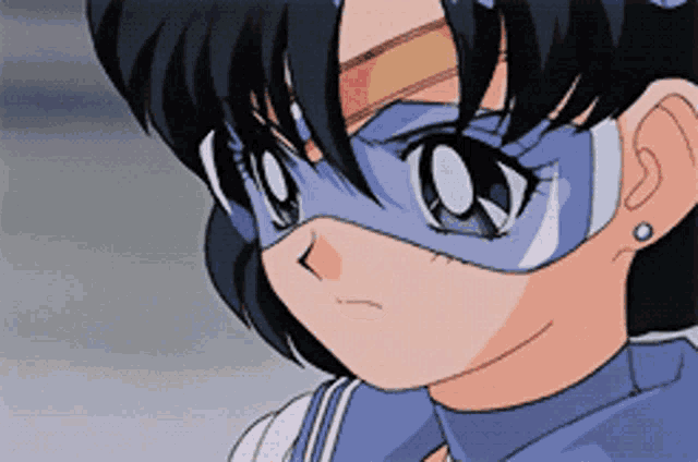 a close up of a girl wearing a mask and earrings