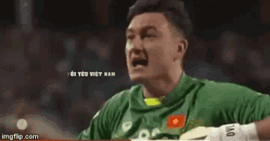 a soccer player wearing a green jersey with the number 22 on it