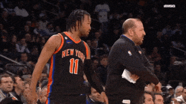a basketball player for the new york knicks is talking to his coach