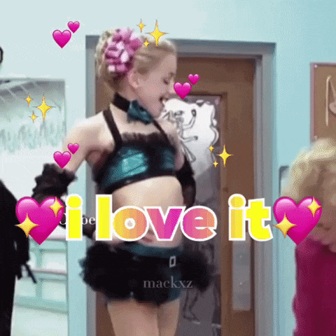 a girl in a crop top and shorts says i love it