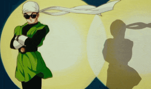 a man with sunglasses and a scarf around his head stands in front of a yellow circle
