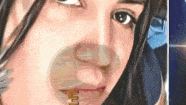 a close up of a woman 's face with a ring in her lip