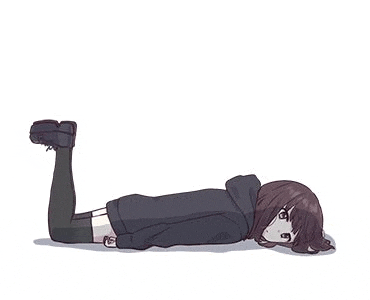 a girl in a black hoodie is laying on the floor with her legs crossed .