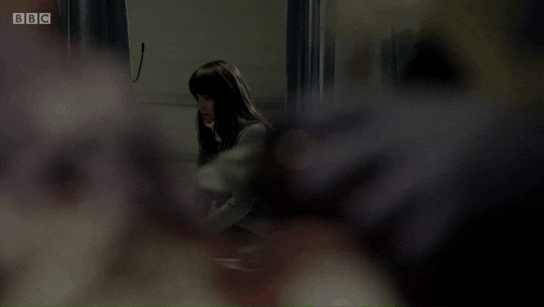 a woman is sitting in a hospital bed with bbc written on the bottom right