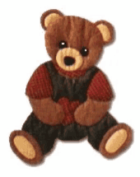 a brown teddy bear wearing overalls and a vest
