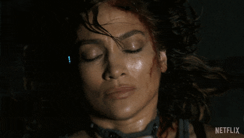 a close up of a woman 's face with netflix written on the bottom right