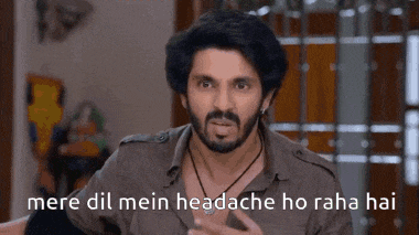 a man with a beard is making a funny face and says mere dil mein headache ho raha hai .