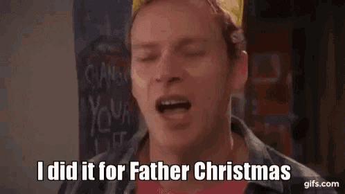 a man with a crown on his head is talking about christmas .