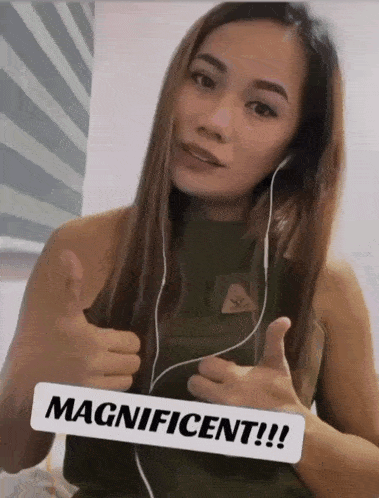 a woman wearing headphones giving a thumbs up with a sign that says magnificent