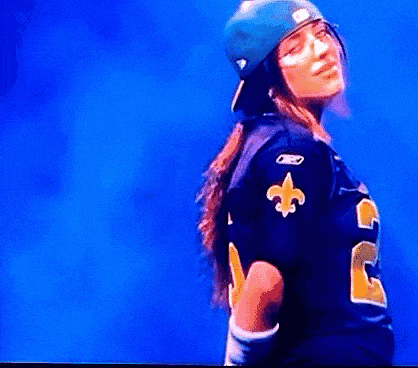 a woman wearing a jersey with the number 3 on the back