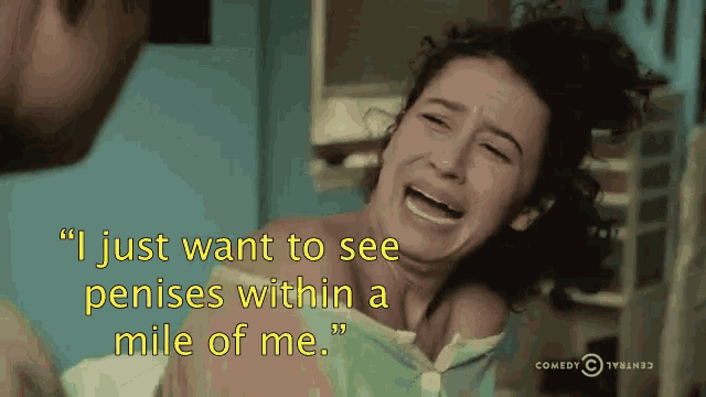 a woman is crying while a man holds her and says " i just want to see penises within a mile of me "