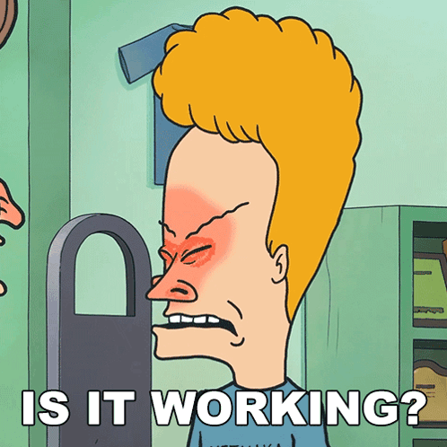 a cartoon of a man with red eyes and the words is it working below him