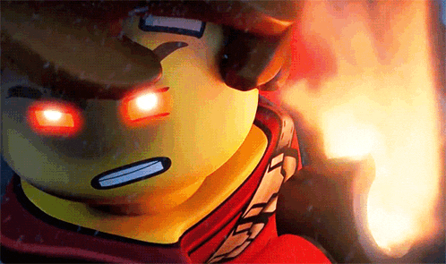a close up of a lego man 's face with red eyes