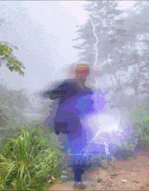 a blurry picture of a person with lightning coming from behind them