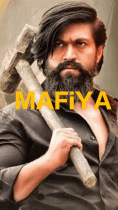a man with a beard and mustache is holding a hammer .