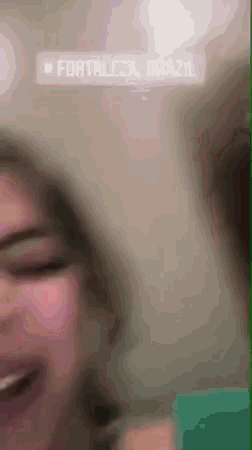 a blurry picture of a person with the words fortaleza brazil on the bottom
