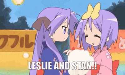 a couple of anime girls standing next to each other with the words leslie and stan