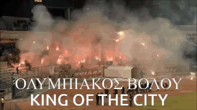 a stadium with flames and the words king of the city on the bottom