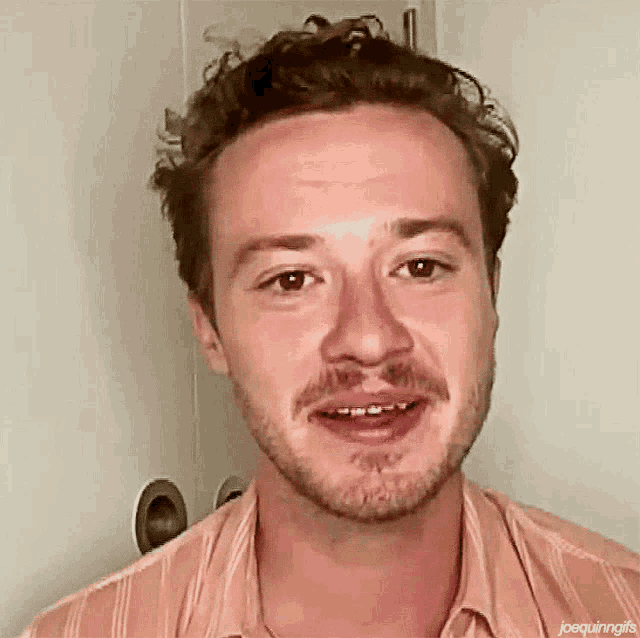 a close up of a man 's face with the words joequinngifs on the bottom