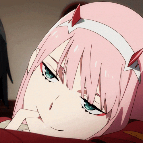 a close up of a pink haired anime girl with blue eyes