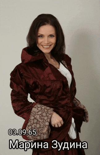 a woman wearing a red jacket has the date 03/09/65