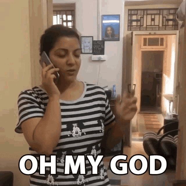 a woman talking on a cell phone with the words oh my god behind her