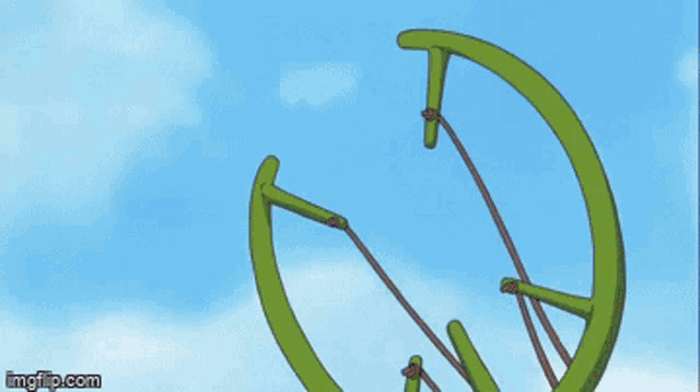a person is holding a green object with a circle on it