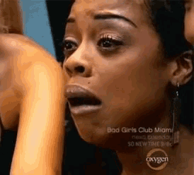 a close up of a woman 's face with the words bad girls club miami written on it